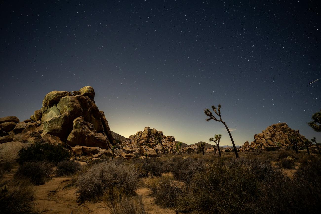 Boulders under a night sky